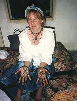 Attachment parenting on the move - low budget backpacking travel with babies and young children - Mary-Clare with henna decoration on her hands, Fes, Morocco